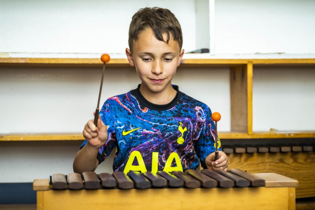 A child playing a music instrument