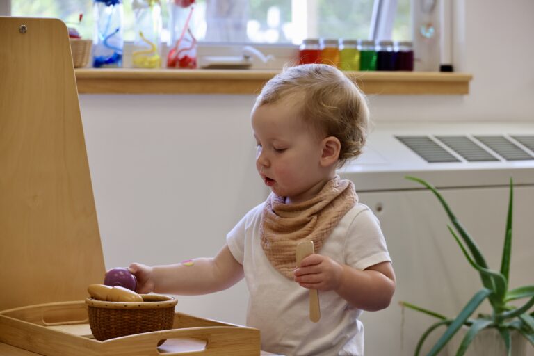 A young child engaged in purposeful, independent work.